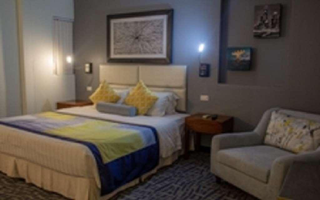 Century Hotel Garapan Rom bilde